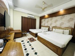 Super Deluxe Four Bed with Balcony 1